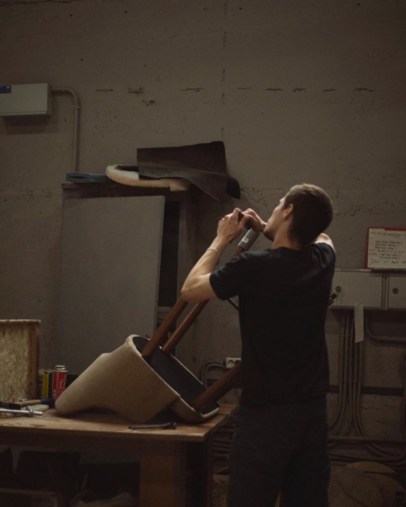 A craftsman checks the frame